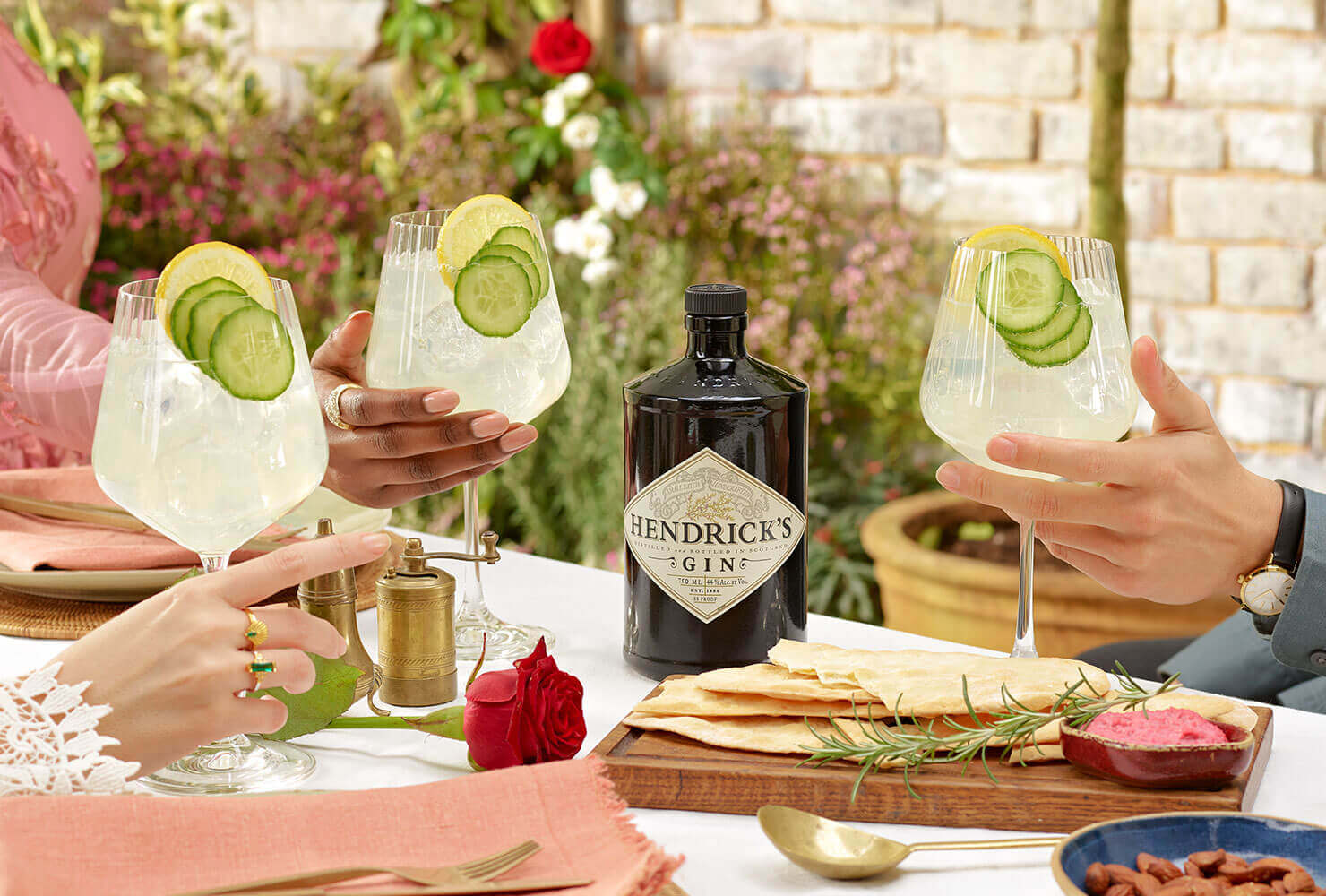 friends raising a toast with Cucumber Lemonade cocktail