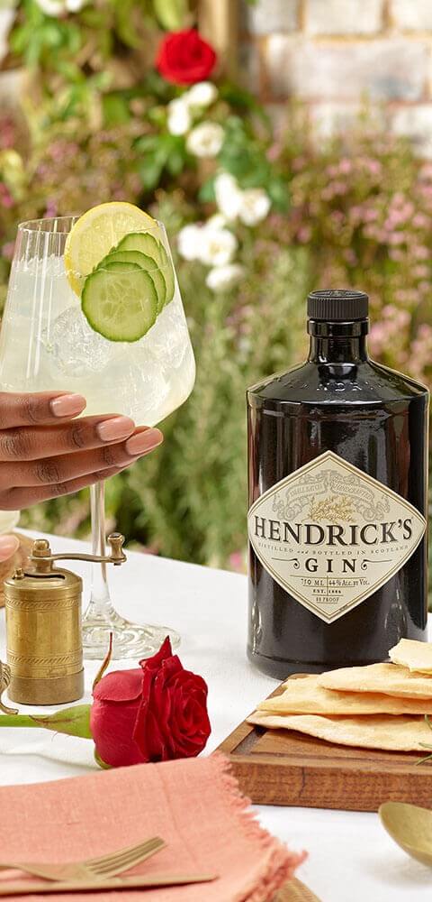 friends raising a toast with Cucumber Lemonade cocktail